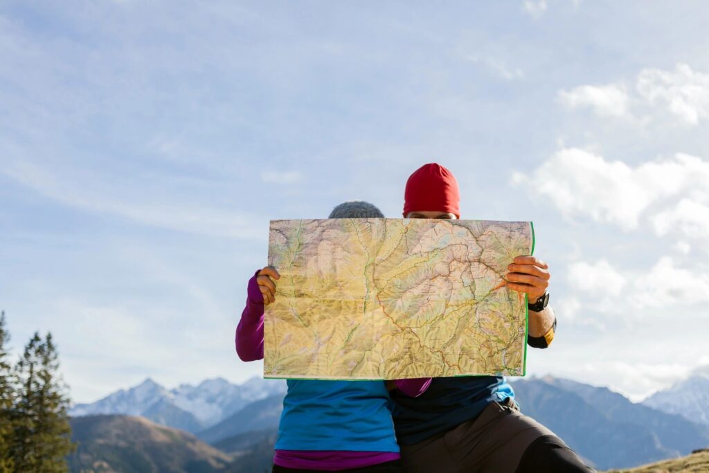 A picture a two people holding up a map