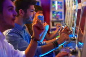 A picture of people playing the slot machines